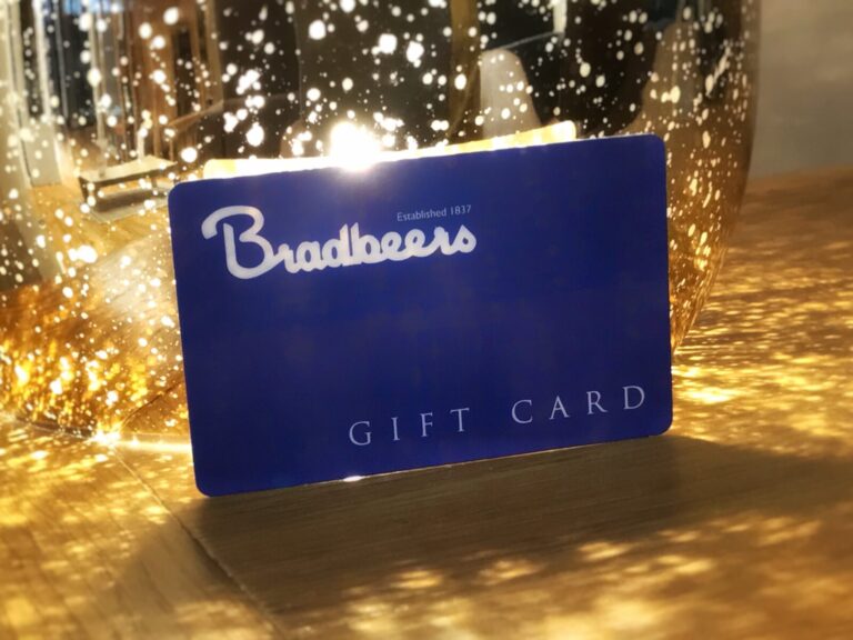 A blue Bradbeers gift card on a table.