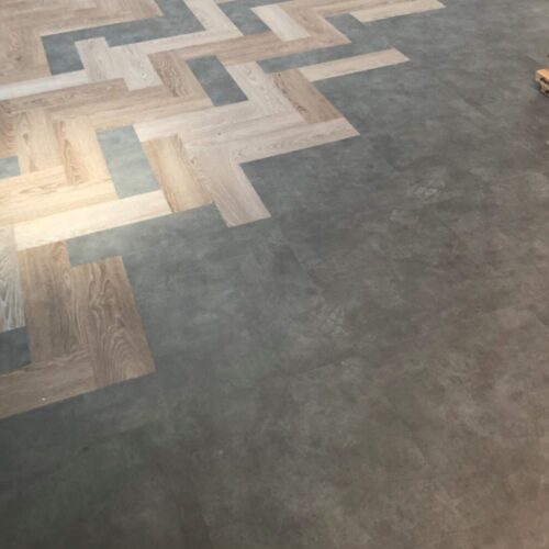 Church hall renovation - LVT transition between Herringbone and square tiles