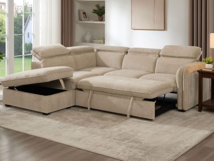 A beige fabric corner sofa bed is shown in a bright, neutral living room, featuring an extended chaise section with hidden storage, a fold‑out sleeping platform, and soft furnishings styled around a rug, side table, and shelving.