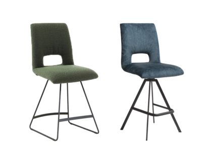 Two bar stools featuring backrests with cut-outs and black metal bases against a white background, the left in green fabric with trapeze legs and the right in blue fabric with a 4 leg tripod base.
