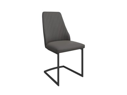 A dark grey faux leather dining chair with a curved ribbed back and black metal cantilever legs.